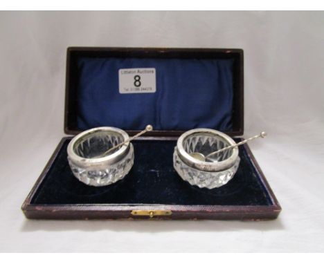 Pair of silver mounted glass salts with spoons