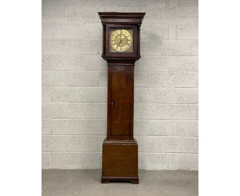 A 19th century oak longcase clock by William Porthouse of Penrith having a moulded cornice over the square brass face with an
