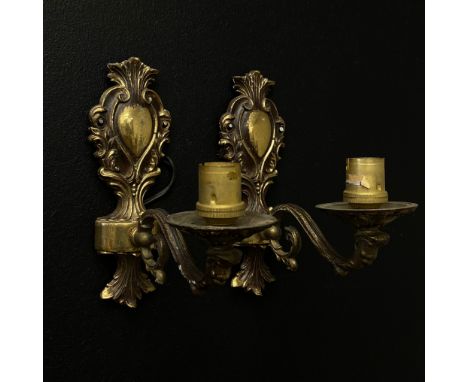 A pair of 19th century style brass wall sconces each having a scrolling foliate back plate with a central cartouche and a sin