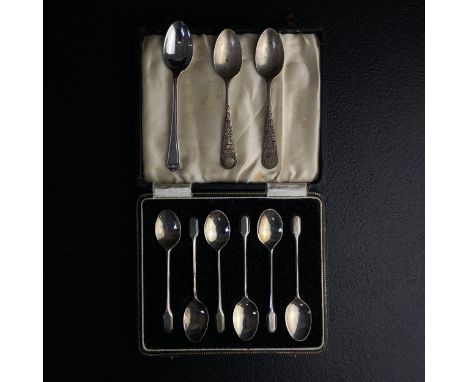 A collection of nine 20th century hallmarked silver teaspoons to include a pair with repousse handles and indistinct maker's 