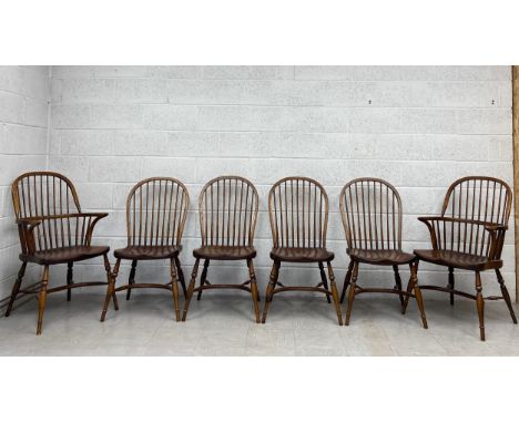 A set of six 20th century beech and elm stick back Windsor dining chairs including two carvers each having an arched top rail