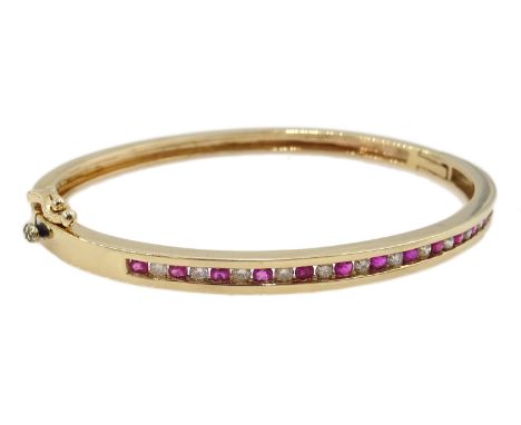 9ct gold channel set ruby and diamond hinged bangle, hallmarked Condition Report Approx 15.1gmClick here for further images, 