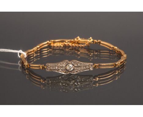 Damenarmband 585 GG, mittig eingearbeitet ein Art déco-Schmuckelement, besetzt m. 1Diamant im Old European Cut von ca. 0.2 ct