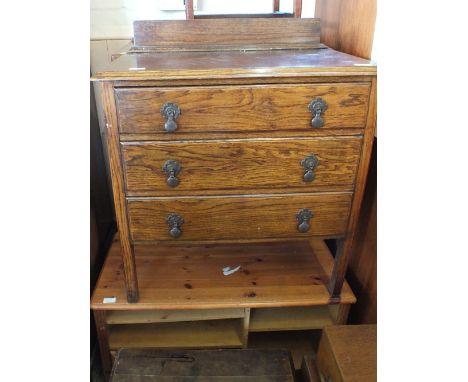 A mahogany tallboy, an oak three drawer chest, pine shelf unit and stool