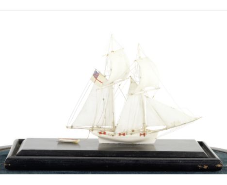 A Dieppe ivory model of a cutter, French,  19th century,the waterline model with fully set sails in ivory, deck with gun port