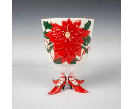 A whimsical ceramic hand painted planter with a raised illustration of a poinsettia flower with the face of a girl in the mid