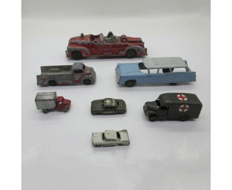 Group of seven die cast cars and trucks. Includes one Tootsie Toy blue-white Ford Country Sedan (P10295) and one red Ford F6 