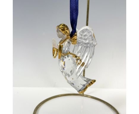 Clear crystal figural with gilt accents on head and clothing with satin crystal face and hands. Wide defined wings pulled bac