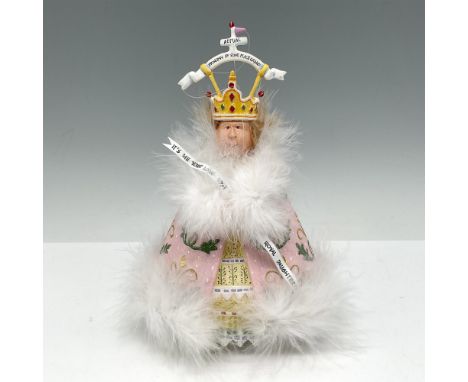 Adorned with crown, feathers and dressed in a pink and yellow gown with a banner - It's Me Your Long-Lost Royal Daughter. Dep