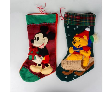 Cotton and felt designed mantle stockings of Mickey holding a gift and Winnie the Pooh on sled. Disney backstamp. Issued: 20t