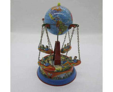 Flight Around The World is an awesome vintage globe carousel tin toy from Western Germany with Soviet Union on the globe. Iss