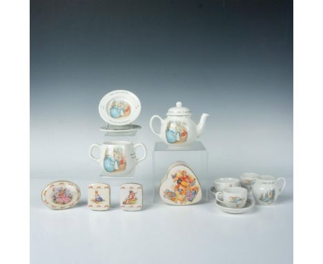 Cheerful group of decorative Bunnykins items. Wedgwood teapot 5.75"L x 3.5"W x 4.25"H, two tiny tea cups, two tiny saucers, t