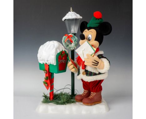 Capture the timeless charm of winter with Mickey donning a cozy coat, scarf, and boots, as he checks his mailbox beside a vin