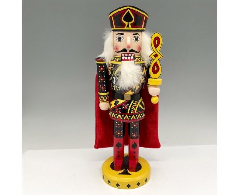 Red cape set against black, yellow and red card designed outfit, wearing his spade crown and holding his staff set on yellow 