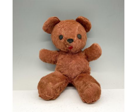Adorable rust colored bear with button eyes, arms outstretched. Hand stitched, stuffed with straw. No mark. Issued: 20th cent