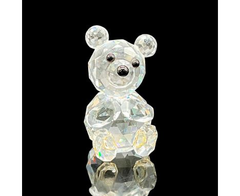 This Swarovski Silver Crystal figurine of a seated teddy bear with tilted head and close paws is crafted in clear faceted cry