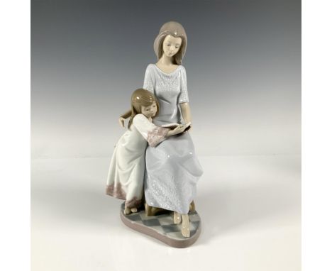 A glossy figure capturing a sweet moment between a mother and a daughter reading a book together. Lladro backstamp. Artist: F
