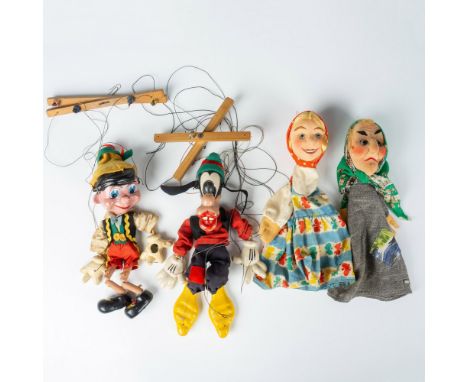 Group of four vintage marionettes with one Pelham strings painted wood and material of Goofy and one of Pinocchio. Also inclu