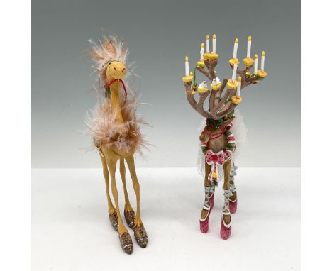 These adorable ornaments will put a smile on your face from their names to their design. Very playful! Dancer has rose colore