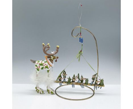 Features two whimsical characters with elegant festive attire and intricate detailing. Includes the original tags and boxes. 