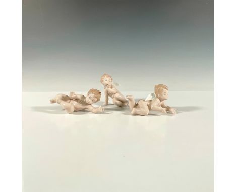 Three young angels entitled, Playing (1006254), Thinking (1006255) and Surprised (1006253). Glossy finishes. Lladro backstamp