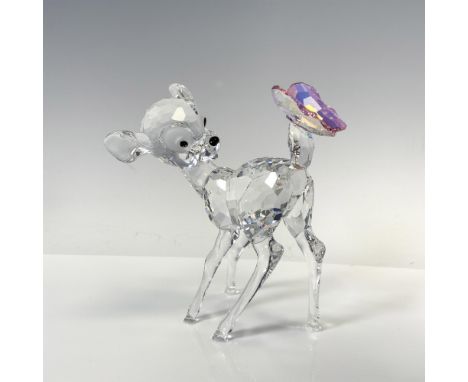 Clear faceted crystal figural looking back with jet crystal inset eyes and nose at his tail where an Aurora Borealis Rosaline