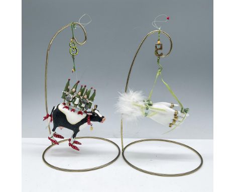 Duo of whimsical holiday ornaments, each with fun intricate details. Both include their original boxes, dimensions of the lar