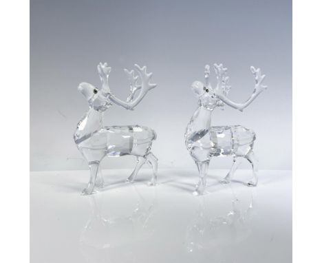 Clear faceted crystal figures with blue/yellow/green eyes. Part of the Exquisite Accents collection. Swarovski backstamp. 747
