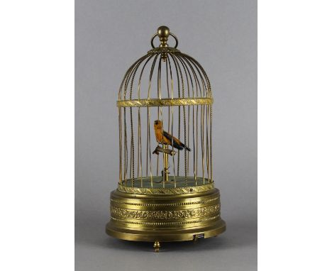A Karl Griesbaum (German, 1872-1941), automaton, singing bird in cage, marked to underside. 29cm high. Slight bending to bars