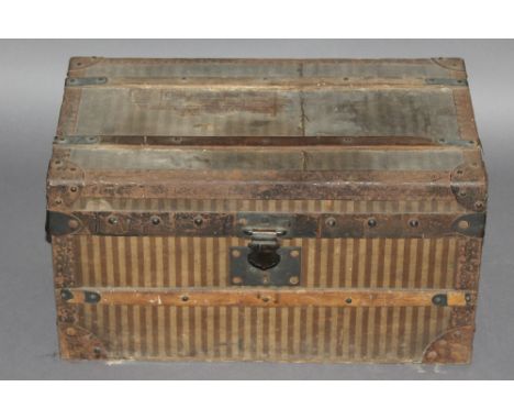 A late 19th Century travel trunk possibly by Louis Vuitton, the lock clasps engraved with a recumbent lion and letter 'L' dep