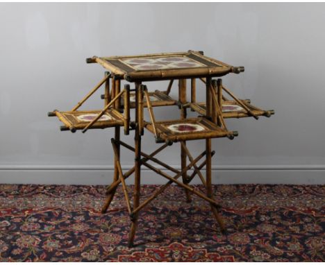 A Victorian bamboo occasional table, tile inserts and four fold-out sections. 75cm high x 48.5cm wide. Condition commensurate