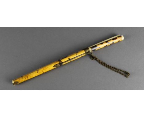 A 19th century Chinese tortoiseshell and bone eating set, knife and two chopsticks. 28cm long. Losses to chopstick points.