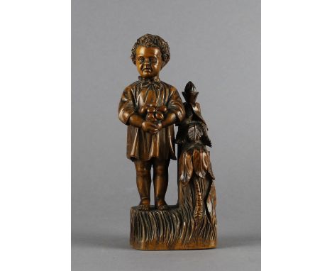 A North European figural carved wood etui. 18.5cm. Two tools missing, slight chipping around neck.