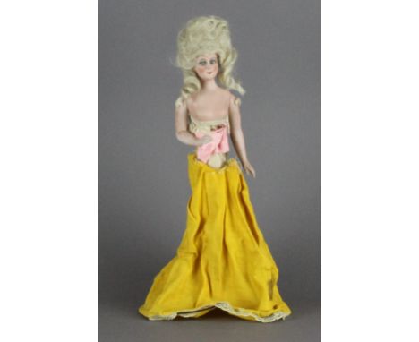 A bisque porcelain lamp shade doll, with articulated arms. 39cm high. Bending to shade structure, missing and damaged clothin