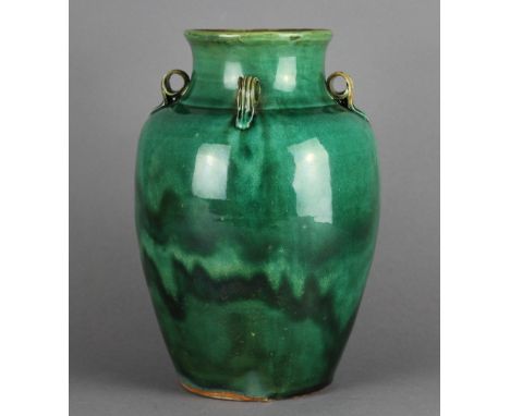 A late 19th/early 20th century Chinese green glazed pottery vase, 25cm high, with associated hardwood stand. Unmarked, crazin