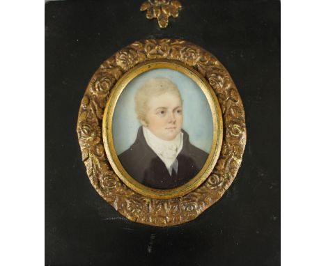 An early 19th century portrait miniature, gilt mount, ebonised frame, marked Andrew Burt to reverse. 6cm x 4.5cm. Good condit