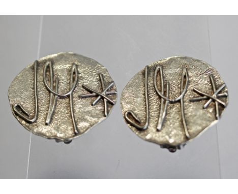 A PAIR OF ELIZABETH II SILVER EARRINGS DESIGNED BY JEAN MUIR, 3.5cm diameter, London 1994 (clip-on fitings), a Continental si
