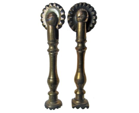 Two similar copper alloy pastry prints/jiggers, each with a cutting wheel and baluster stem, one having a square print the ot