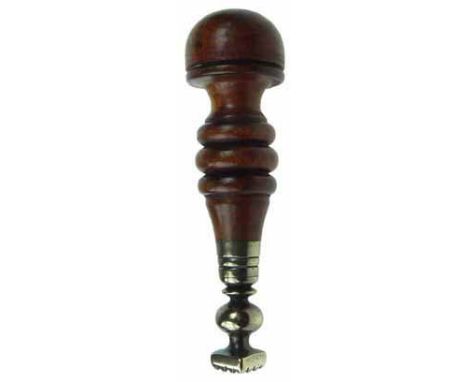 A copper alloy pastry print with knopped stem, lozenge-form print and turned walnut handle, early 19th century. 13cm long In 