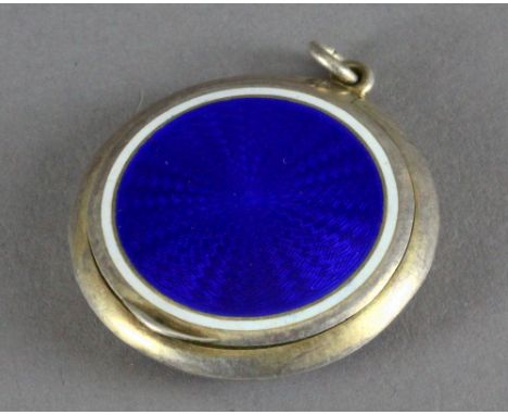 An blue enamelled silver powder compact, by Cohen & Charles, with London import marks 1921, 4.2cm diameter, weight 20grams. (