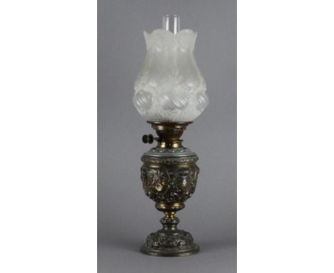 A 19th century spelter oil lamp, of ornate design with moulded and frosted glass shade, Hinks Duplex patent adjuster. 31.5cm 