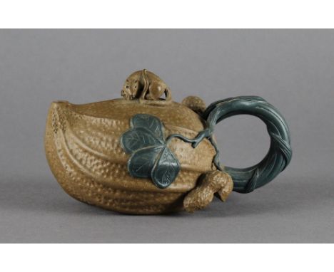 A Chinese Yixing stoneware teapot, with rat-form finial, impressed marks. 8cm high. Good condition.