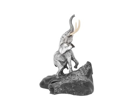 A Zimbabwean Silver Model of a Bull Elephant Reaching, by Patrick Mavros, Harare, Circa 1992 realistically modelled and with 