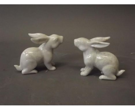 A pair of Chinese mountain jade figures of hares, 4" high 