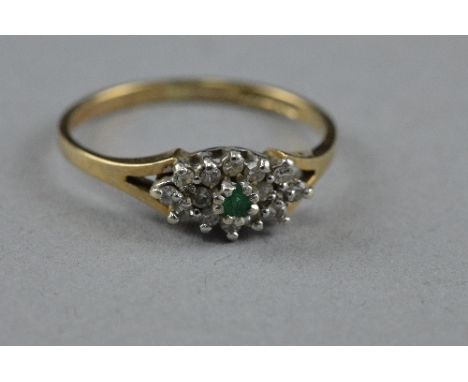 A 9CT EMERALD AND DIAMOND RING, size k, approximate weight 1.5 grams
