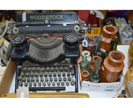 A WOODSTOCK TYPEWRITER and various stoneware and glass bottles and ink bottles
