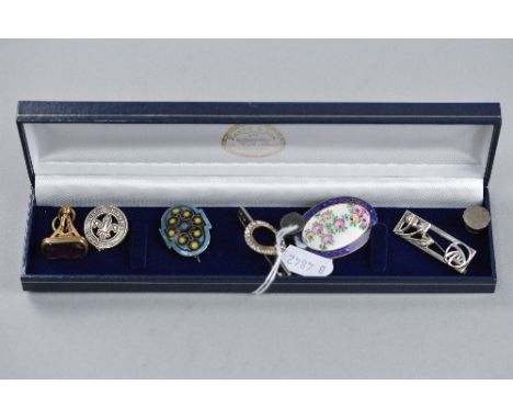 A MIXED LOT OF SILVER AND ENAMEL BROOCHES, fob, etc