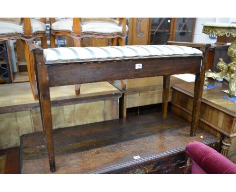 AN EDWARDIAN MAHOGANY DUET PIANO STOOL