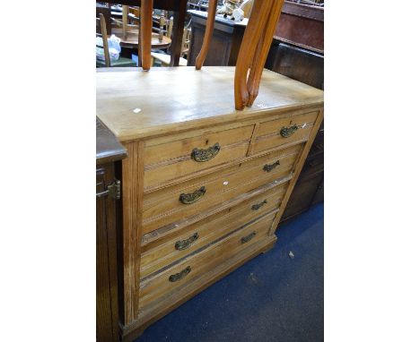 AN EDWARDIAN LIGHT OAK CHEST, of two short and three long drawers with brass handles, approximate size width 103cm x depth 49