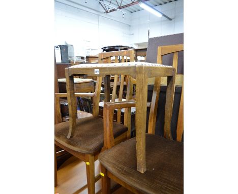 AN OAK PIANO STOOL, an oak open bookcase and a firescreen (3)